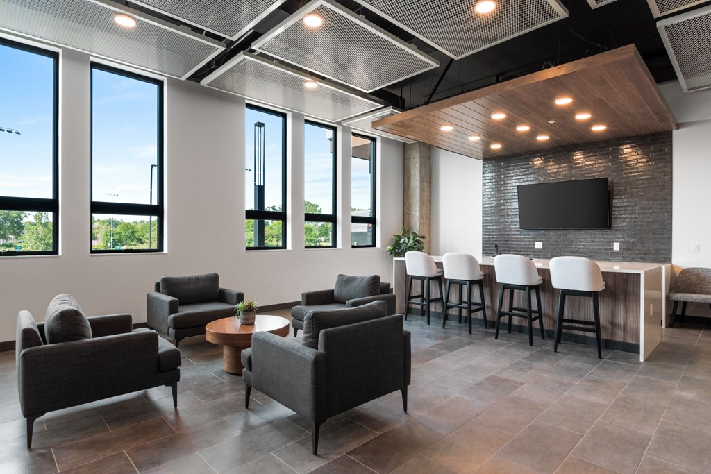 a room filled with furniture and a large window